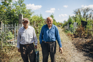 The caretaker of Tiraspol Jewish Cemetery, Nuhim Kamenker (left) with friend Lenya Begberyan.